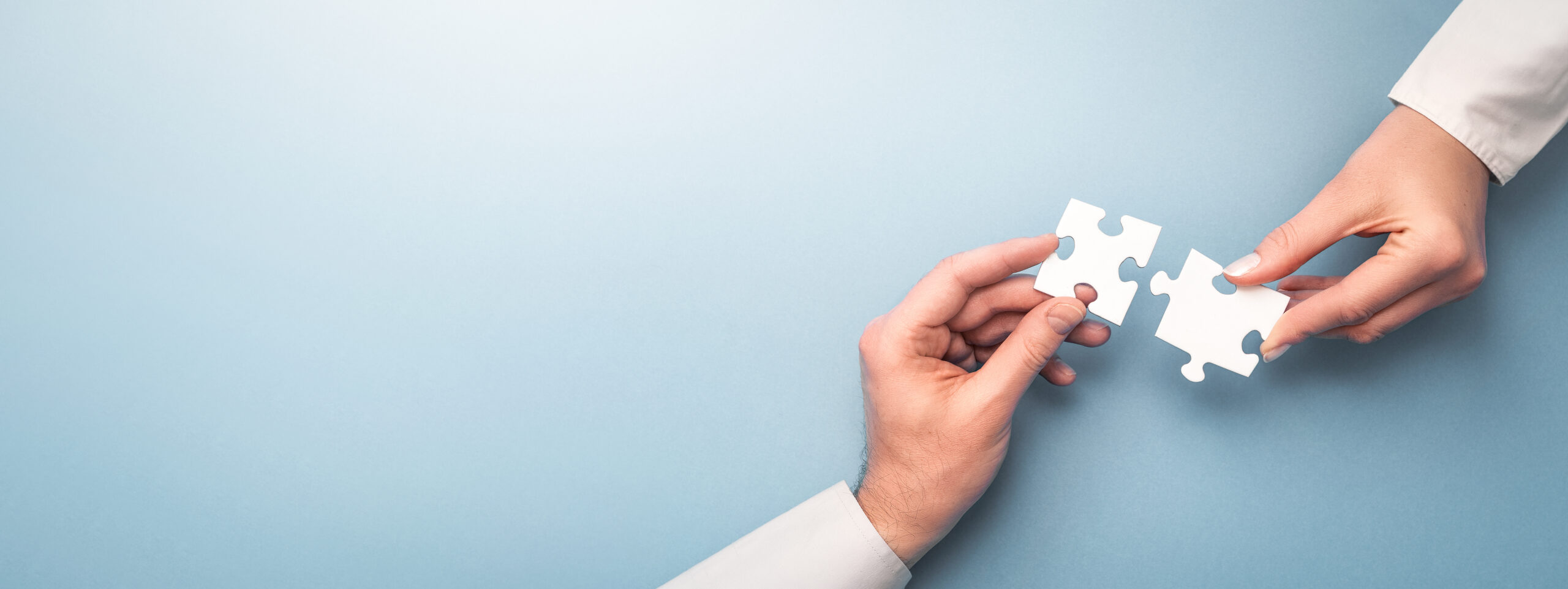 People holds in hand a jigsaw puzzle. Business solutions, succes